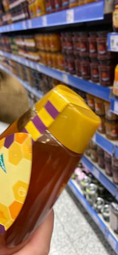 Miel en frasco hexagonal con tapa amarilla