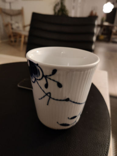 White Ceramic Cup with Blue Floral Design