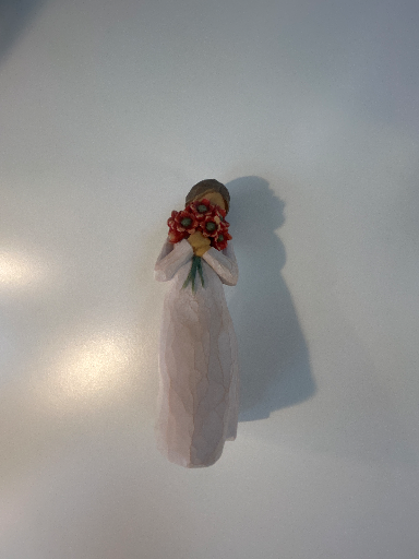 Lladro Ceramic Figurine of a Woman Holding Flowers